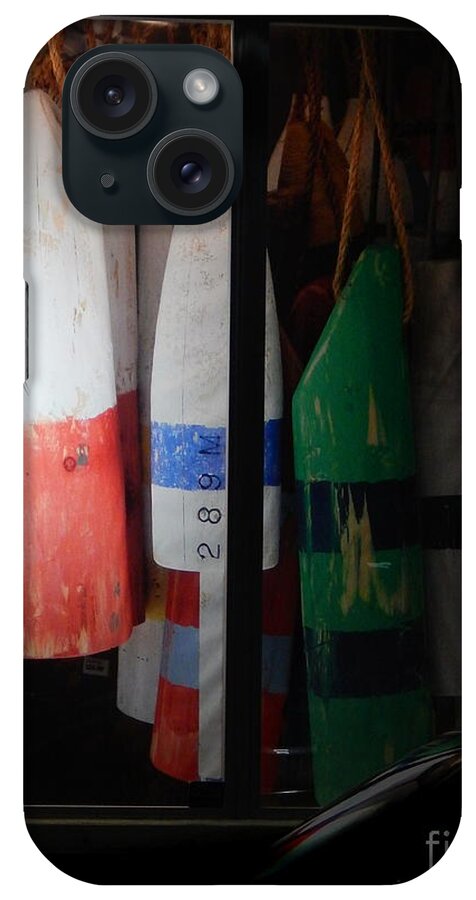 Buoys Displayed Side By Side Inside A Display Window In Downtown Key West .evening iPhone Case featuring the photograph Window Buoys key West by Priscilla Batzell Expressionist Art Studio Gallery