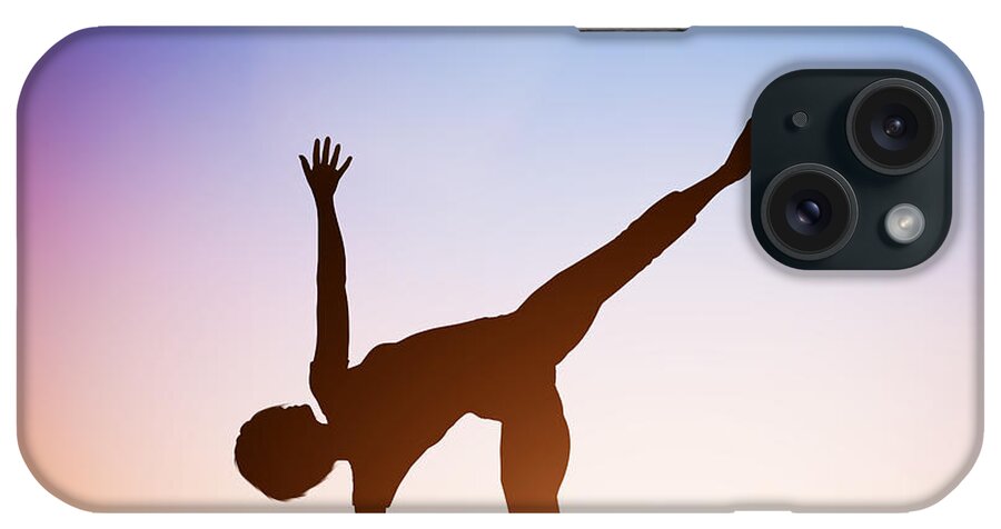 Yoga iPhone Case featuring the photograph Woman in half moon yoga pose meditating at sunset by Michal Bednarek
