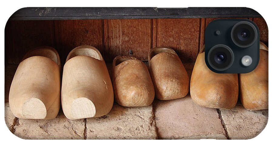 Clogs iPhone Case featuring the photograph Wooden clogs by Emanuel Tanjala