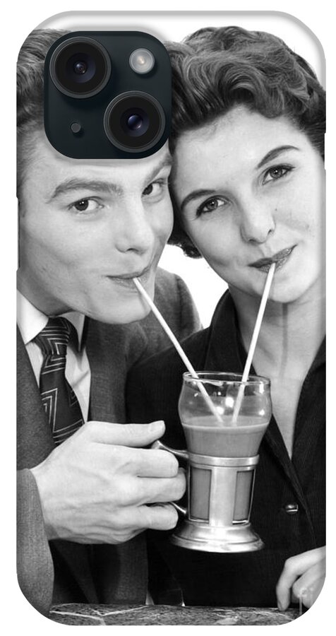 1950s iPhone Case featuring the photograph Young Couple Sharing A Milkshake by H. Armstrong Roberts/ClassicStock
