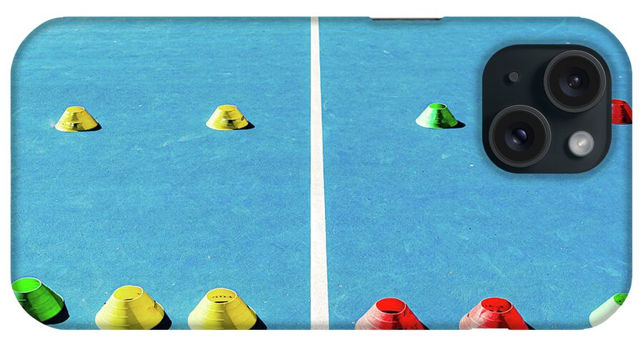 Active iPhone Case featuring the photograph Colorful plastic cones on a blue cement tennis court with white #2 by Joaquin Corbalan