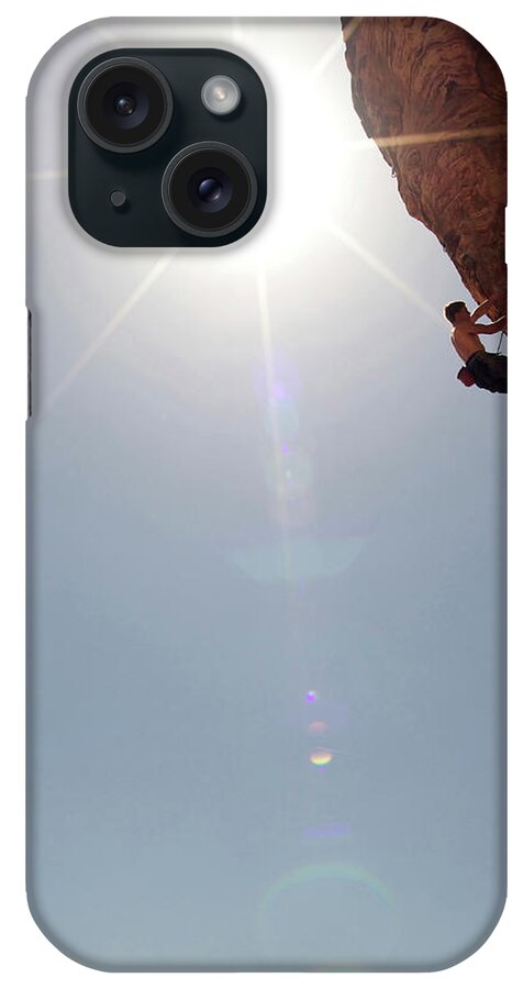 Recreational Pursuit iPhone Case featuring the photograph A Rock Climber Ascends A Red Rock Face #28 by Jared Mcmillen