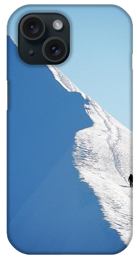 Snow iPhone Case featuring the photograph A Person Hiking On A Mountain Peak by Hakan Hjort