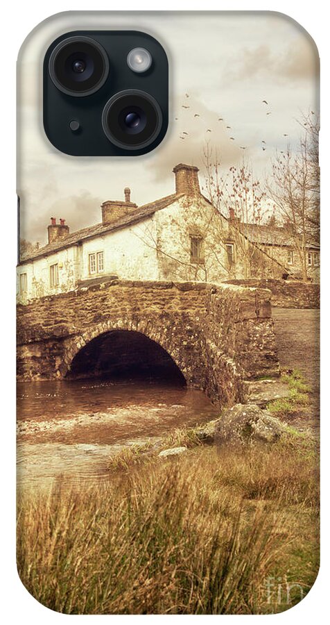 Yorkshire iPhone Case featuring the photograph A Small Village Scene With A Cottage And Bridge by Ethiriel Photography