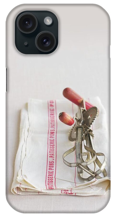 Ip_11236039 iPhone Case featuring the photograph An Old Fashioned Hand Mixer On A Dish Towel by Jennifer Martine