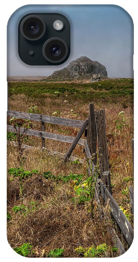 Coast iPhone Case featuring the photograph An Old Wooden Fence In A Field Leading To A Large Rock In The Fog by Cavan Images