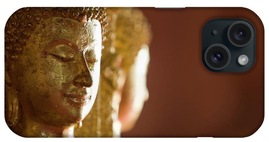 Gilded iPhone Case featuring the photograph Ancient Buddha Images In A Thai by Enviromantic
