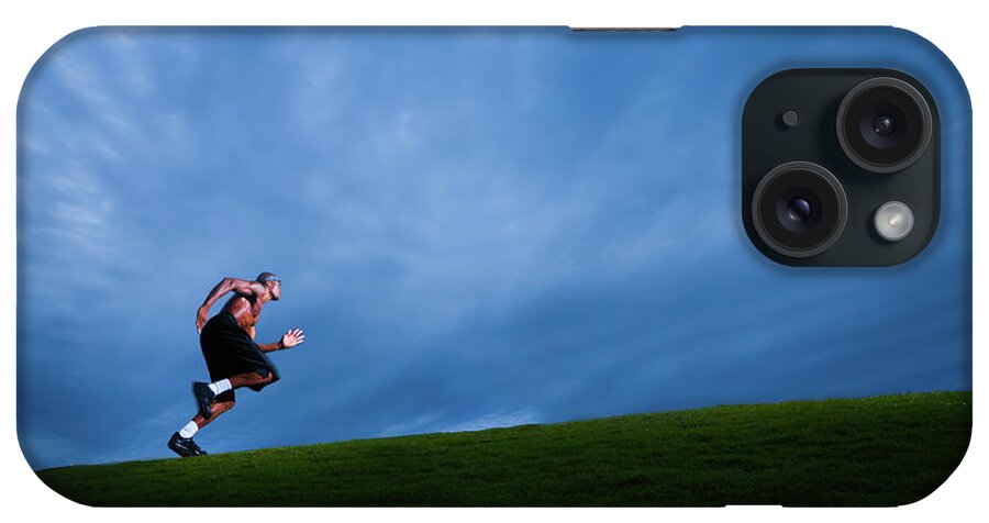 Expertise iPhone Case featuring the photograph Athlete Running Up Grassy Hill by Johnnyhetfield