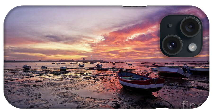 Shore iPhone Case featuring the photograph Boats at La Caleta Beach at Dusk under a Fiery Sky Cadiz by Pablo Avanzini