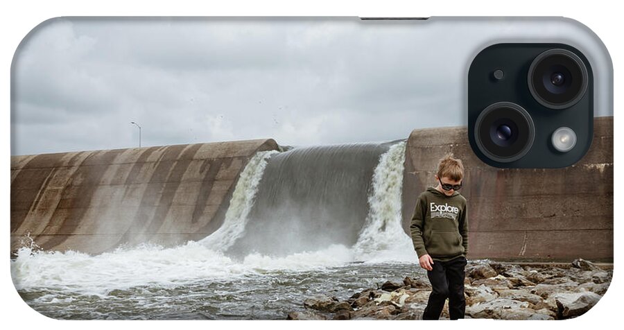 Spillway iPhone Case featuring the photograph Boy Walking In Front Of Waterfall Spillway At Lake by Cavan Images / Krista Taylor