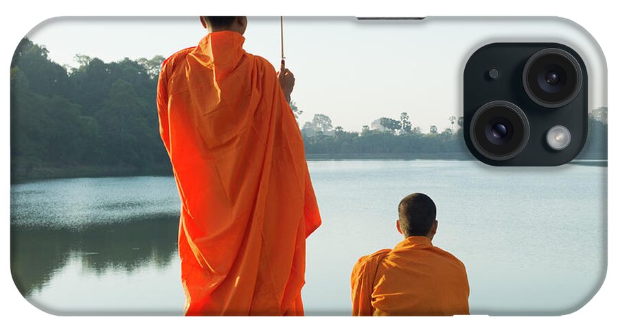 Young Men iPhone Case featuring the photograph Buddhist Monks Standing In Front Of by Martin Puddy