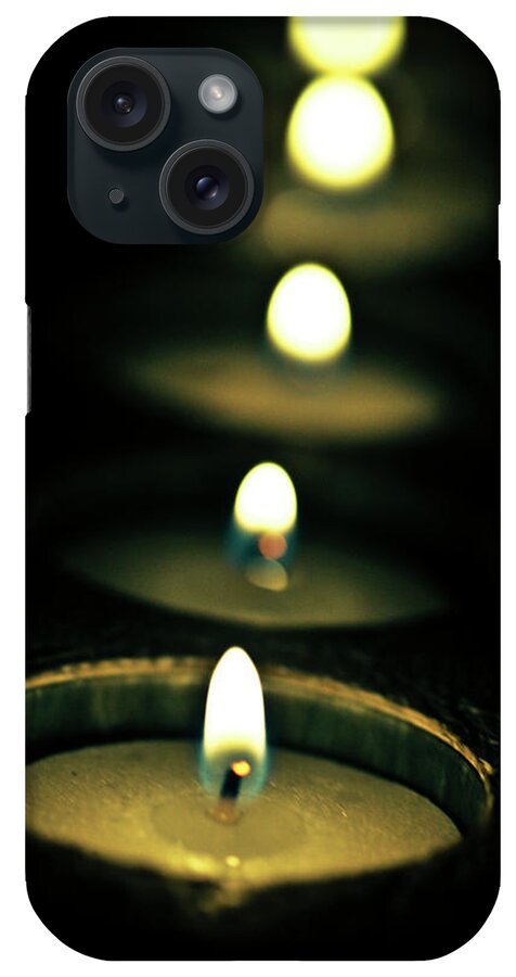 In A Row iPhone Case featuring the photograph Candles In A Church by Rafa Llano Instantaneas