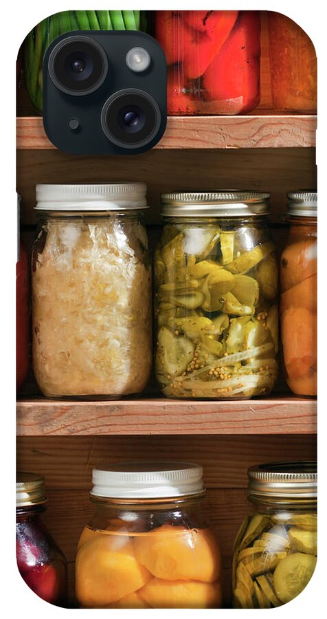 Preserved Food iPhone Case featuring the photograph Canning Jars Of Canned Food On Shelves by Yinyang