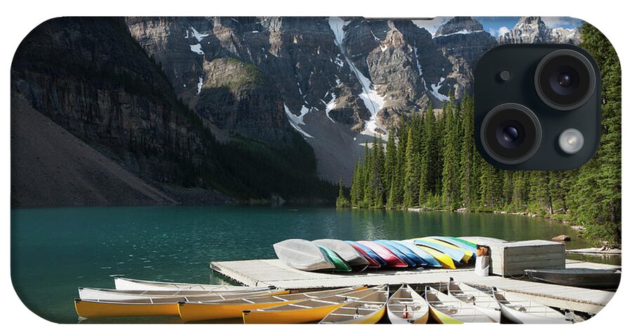 Tranquility iPhone Case featuring the photograph Canoes Around A Dock On A Lake With by Michael Interisano / Design Pics