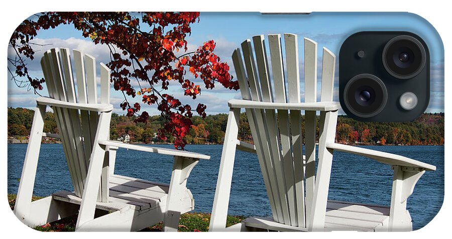 Lake Winnipesaukee Fall Foliage iPhone Case featuring the photograph Chairs for two at the lakes edge by Jeff Folger