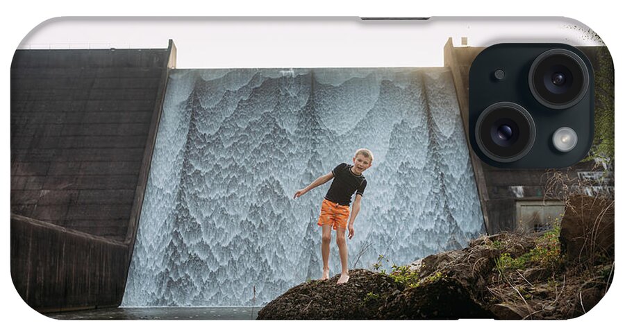 Crab Orchard iPhone Case featuring the photograph Child Climbing Rocks In Front Of Spillway Waterfall by Cavan Images / Krista Taylor
