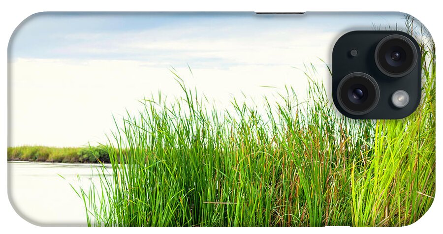 Scenics iPhone Case featuring the photograph Empty Kayak Resting In Reeds by Catlane