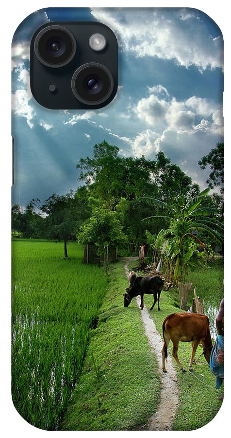 Mature Adult iPhone Case featuring the photograph Farmer And His Livestock On Lush Green by Raqeebul Ketan