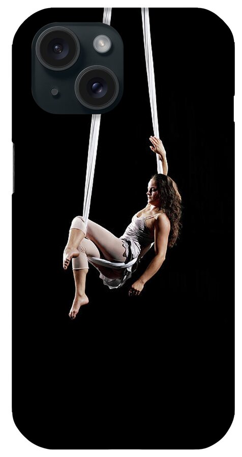 Expertise iPhone Case featuring the photograph Female Aerialist Seated On Suspended by Thomas Barwick