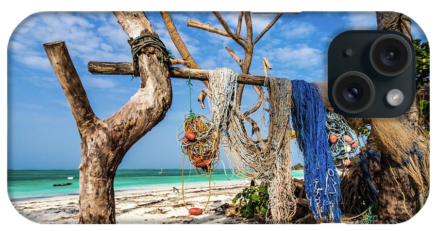 Beach iPhone Case featuring the photograph Fishing nets drying on the beach by Lyl Dil Creations