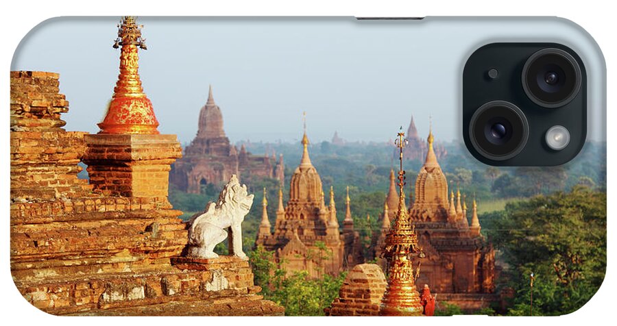Pagoda iPhone Case featuring the photograph Guard Statue And Bagan Temple Field by Arturbo
