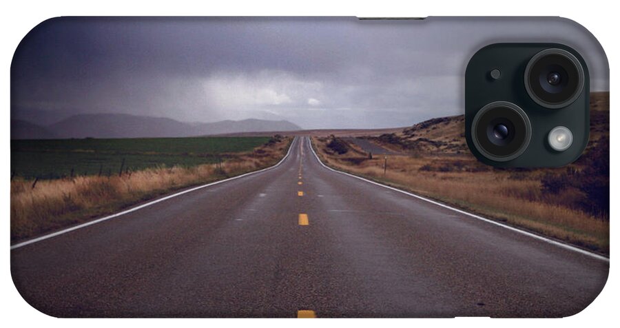 Tranquility iPhone Case featuring the photograph Highway Shot With Dark Storm Clouds by Lori Andrews