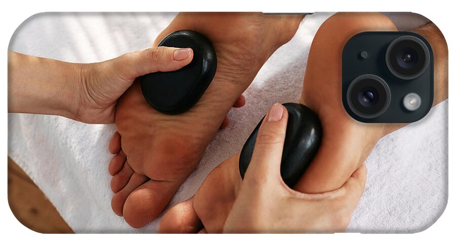 Massage iPhone Case featuring the photograph Hot Stone Foot Massage Therapy by Peakstock / Science Photo Library