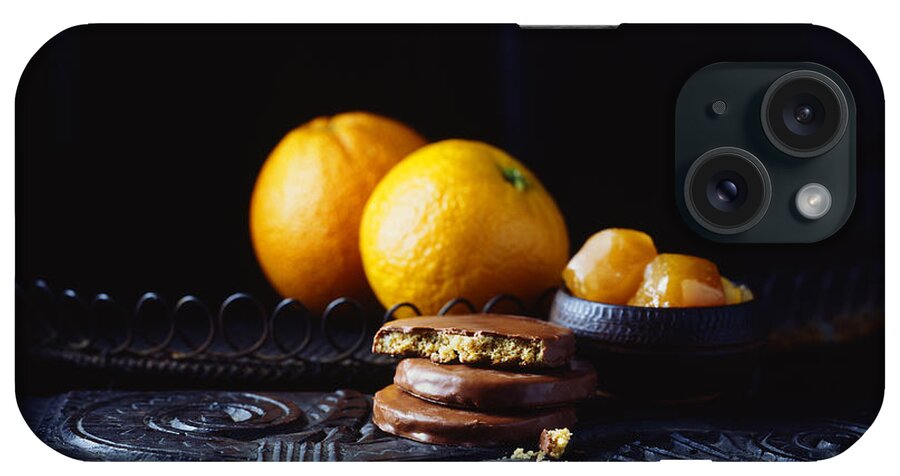 Black Color iPhone Case featuring the digital art Luxury Chocolate Coated Orange Flavoured Biscuits And Oranges On Vintage Table, Low Key by Diana Miller