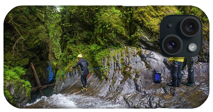 Rappeling iPhone Case featuring the photograph Man Throws Rope Down Waterfall Before A Rappel. by Cavan Images
