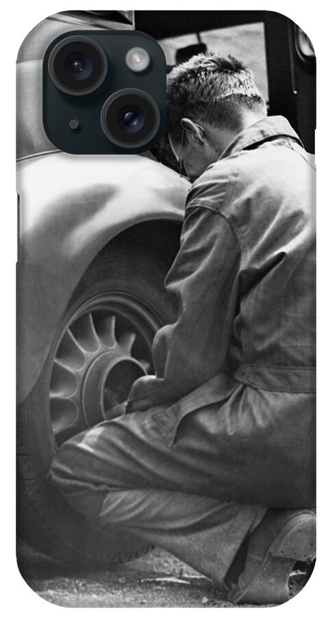 Working iPhone Case featuring the photograph Mechanic Changing Tire On Car by George Marks