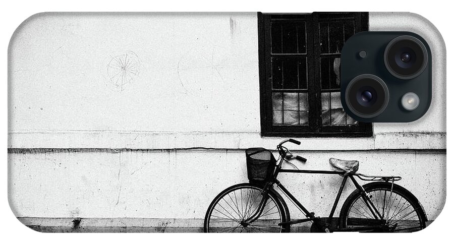 Built Structure iPhone Case featuring the photograph Old Bicycle Parked Against Wall by Librarymook