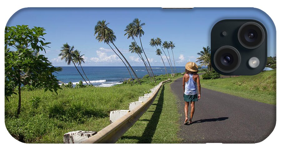Adventure iPhone Case featuring the photograph One Guy, Walking Down Street Of Samoa, Next To The Ocean, Samoa by Cavan Images