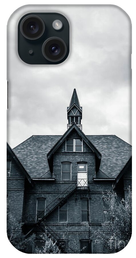 Brick iPhone Case featuring the photograph Peaked Building Against Stormy Skies by Edward Fielding