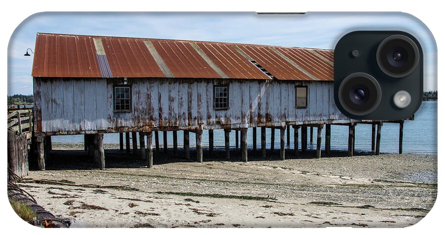 Pilings And Rusty Roof iPhone Case featuring the photograph Pilings and Rusty Roof by Tom Cochran