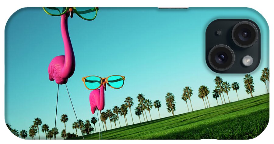 Artificial iPhone Case featuring the photograph Plastic Pink Flamingos On A Green Lawn by Skodonnell