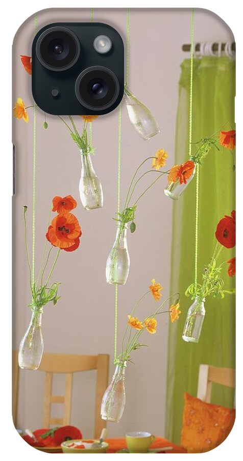 Ip_00272047 iPhone Case featuring the photograph Poppies In Small Bottles Hanging From Ceiling by Friedrich Strauss