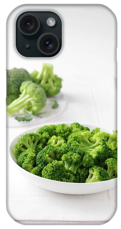 Food Preparation iPhone Case featuring the digital art Raw Broccoli On Marble Cutting Board And Bowl Of Boiled Broccoli by Diana Miller