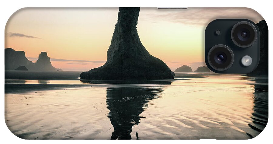 Beach iPhone Case featuring the photograph Sea Stack Silhouette at Bandon Beach by Alex Mironyuk