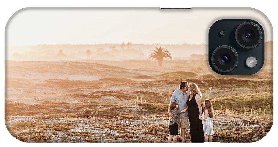 Family Of Four iPhone Case featuring the photograph Side View Of Happy Family Of Four On Beach At Sunset by Cavan Images
