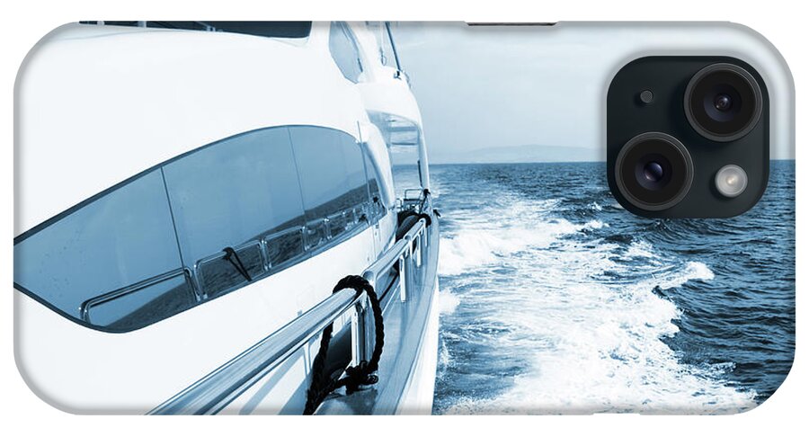 Desaturated iPhone Case featuring the photograph Side View Of Luxury Yacht Sailing The by Petreplesea