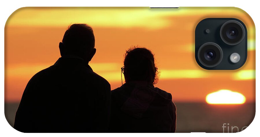 Happiness iPhone Case featuring the photograph Silhouetted Old Couple Staring at the Sunset by Pablo Avanzini