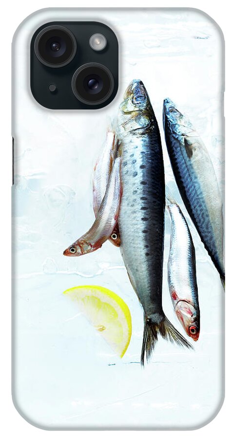 White Background iPhone Case featuring the photograph Small Fish On Block Of Ice With Lemon by Annabelle Breakey