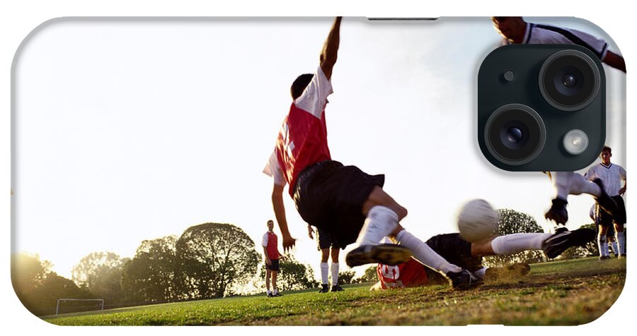 Soccer Uniform iPhone Case featuring the photograph Soccer Players Tackling For Ball by Ryan Mcvay