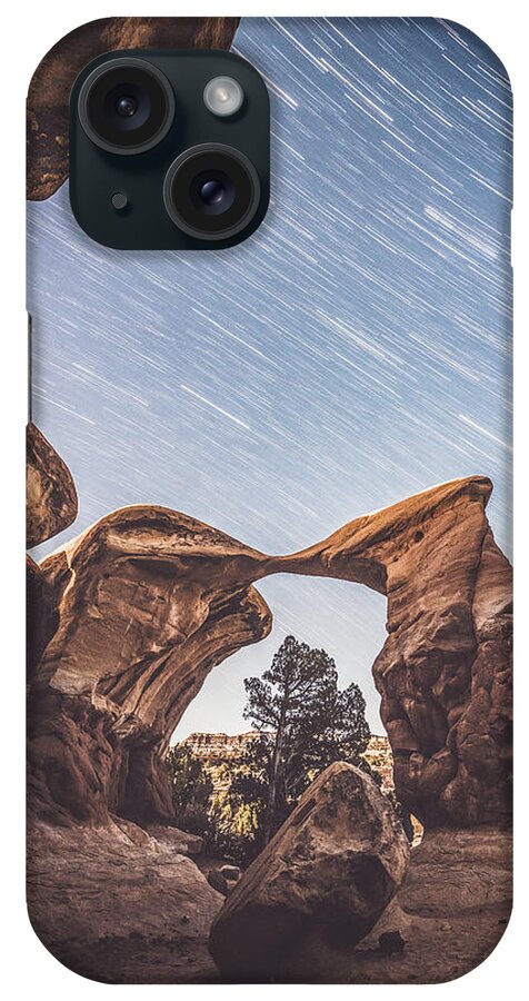Devil's Garden iPhone Case featuring the photograph Star trails over Metate Arch by Mati Krimerman