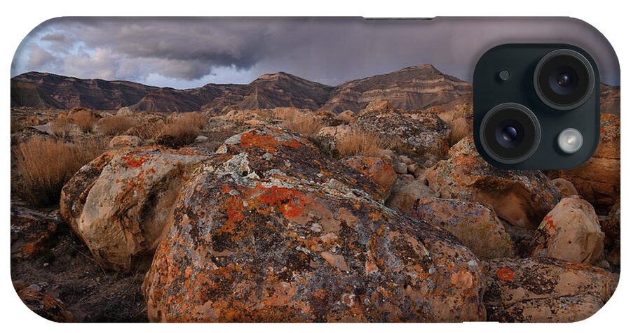 Grand Junction iPhone 15 Case featuring the photograph Storm over Book Cliffs and Colorful Boulders by Ray Mathis