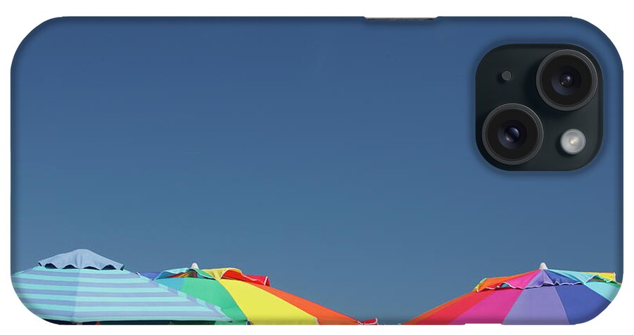 Clear Sky iPhone Case featuring the photograph Sun Umbrellas by Carlos Davila