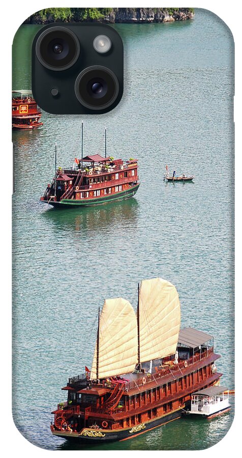Seascape iPhone Case featuring the photograph Tourist wooden Boats at Halong Bay Vietnam by Michalakis Ppalis