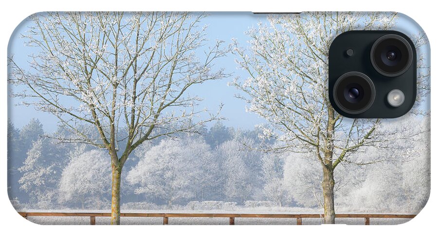 Landscape iPhone Case featuring the photograph Two trees in a deep frozen winter by Simon Bratt