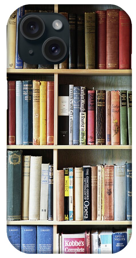 Hardcover Book iPhone Case featuring the photograph Various Books On Shelves by Nick White