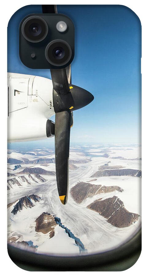 Air Travel iPhone Case featuring the photograph View Of Propeller And Glacier Through Airplane Window. by Cavan Images